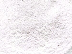 Aluminum Acetate, Granular with some dark specks
